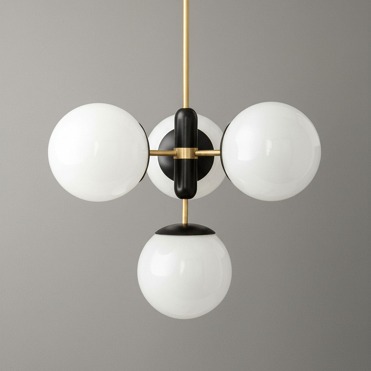 Art Deco chandelier with three white glass globes and sealed brass frame against gray background. - CHANDELIER MODEL NO. 4321