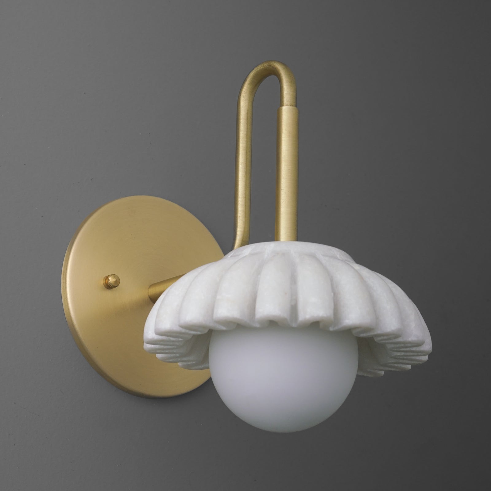 Brushed brass wall sconce with fluted white glass shade and round globe bulb below. - SCONCE MODEL NO. 8633