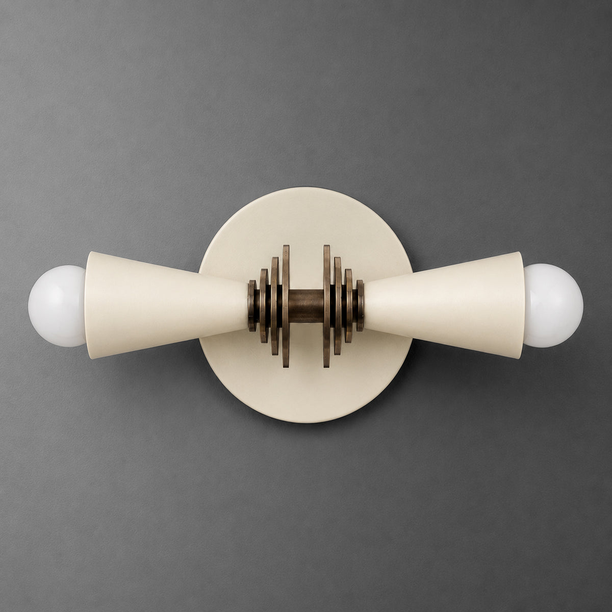 Cream-colored metal vanity light with two cone-shaped shades and round wooden accent on circular base. - VANITY LIGHT MODEL NO. 6934
