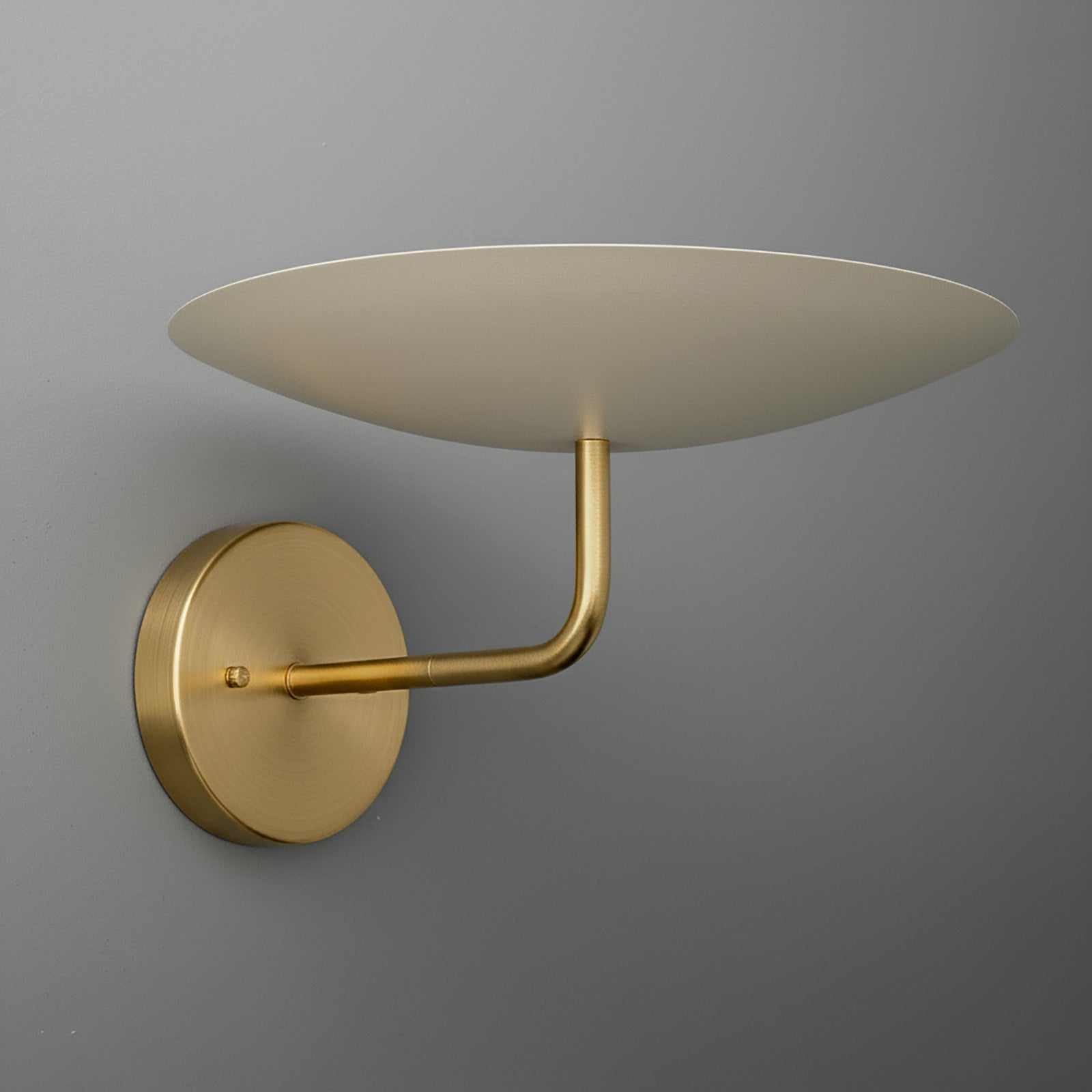 Matte gold metal wall sconce with round backplate and flat, disc-shaped shade. - SCONCE MODEL NO. 1504
