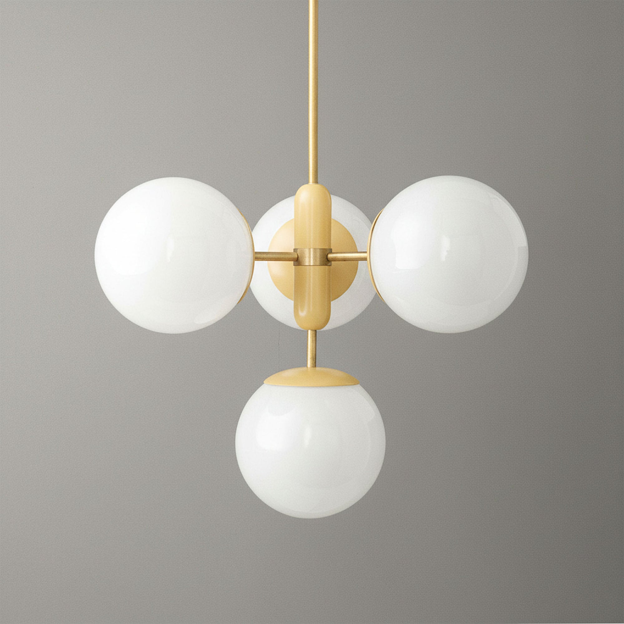 Scandinavian Art Deco chandelier with four white glass globes and gold metal frame. - CHANDELIER MODEL NO. 4321