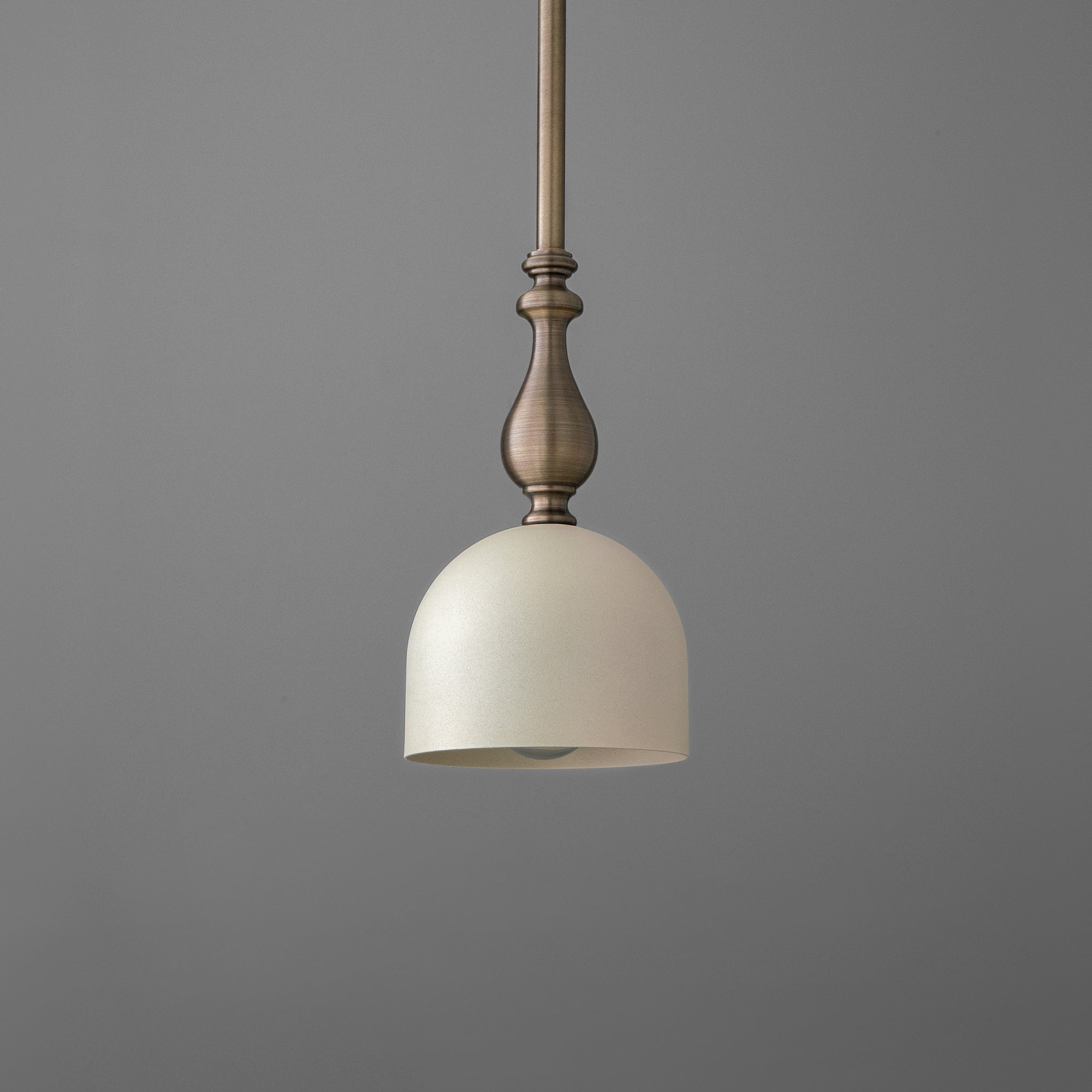 Antique brass pendant light with cream dome shade and detailed stem, suspended on rod. - PENDANT MODEL N0. 6780
