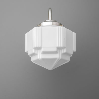 White geometric glass sconce with tiered, faceted design and brushed metal mounting bracket. - SCONCE MODEL NO. 1058