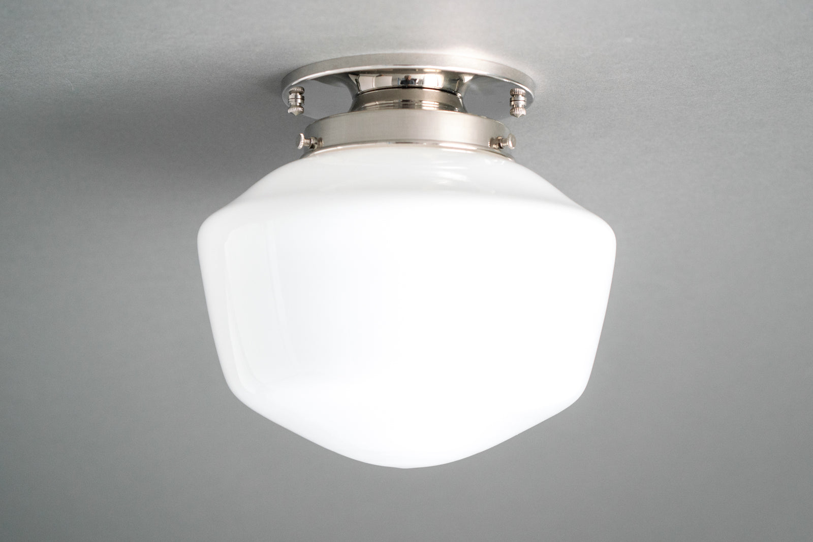 Flush mount ceiling light in Polished Nickel holding an opal glass schoolhouse shade. - CEILING LIGHT MODEL NO. 7149