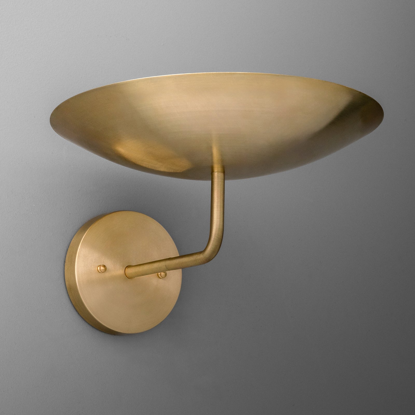 Brushed gold metal wall sconce with a round base and upward curved shallow dome shade. - SCONCE MODEL NO. 1504