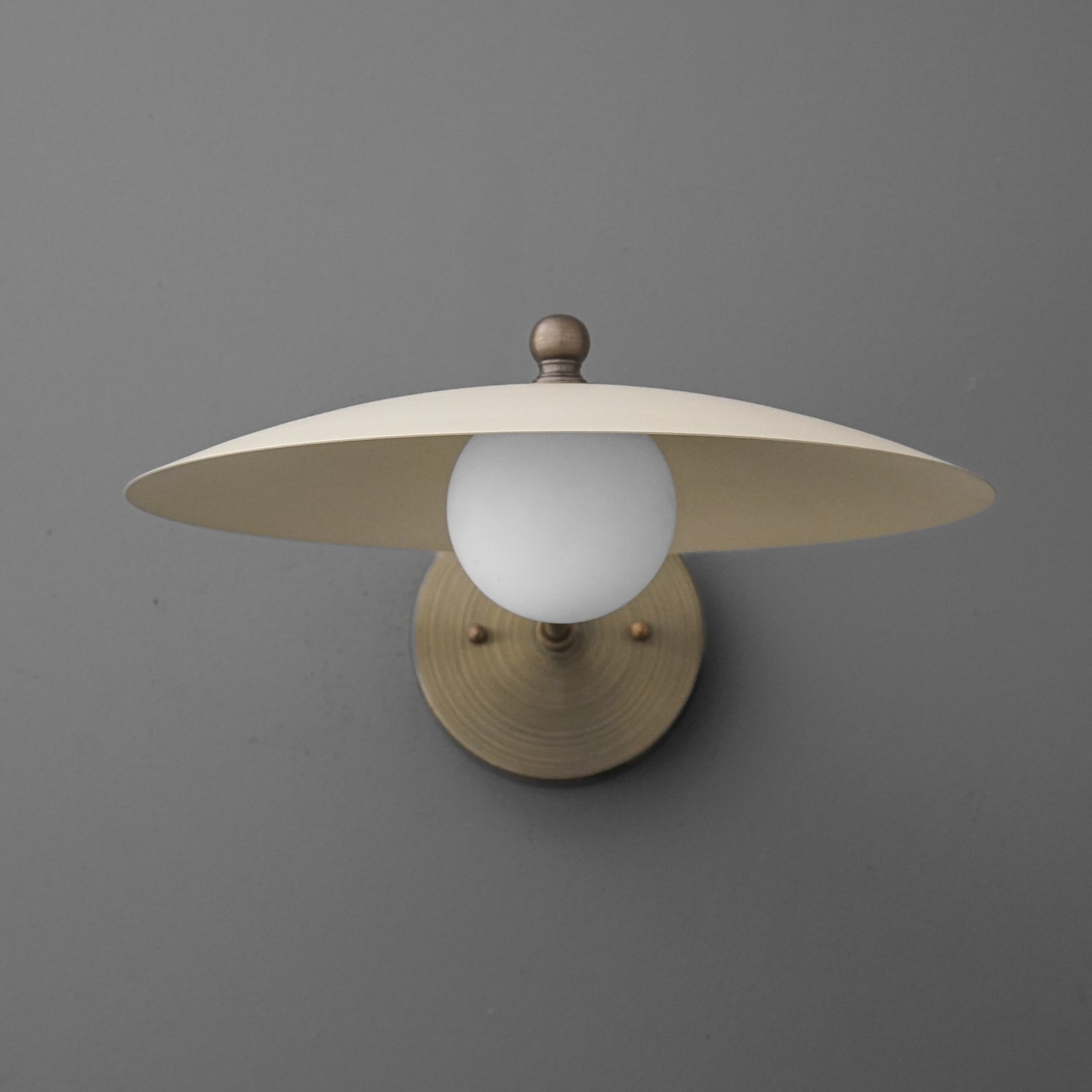 Brushed brass 1-bulb wall sconce with frosted white globe and wide flat metal shade. - SCONCE MODEL NO. 1161
