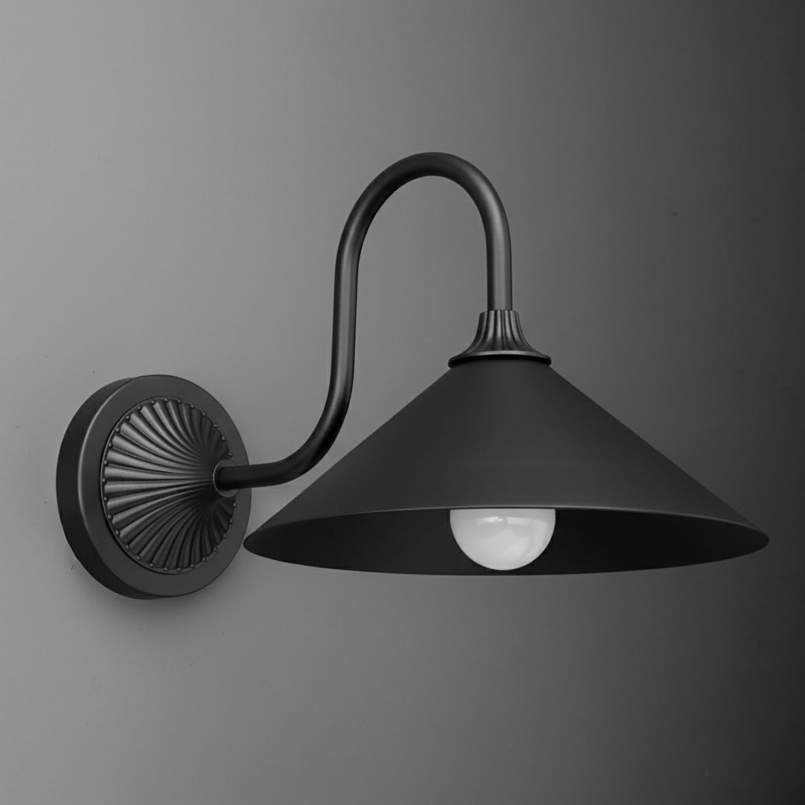 Matte black metal wall sconce with a wide conical shade and curved arm attached to a round decorative backplate. - SCONCE MODEL NO. 1067