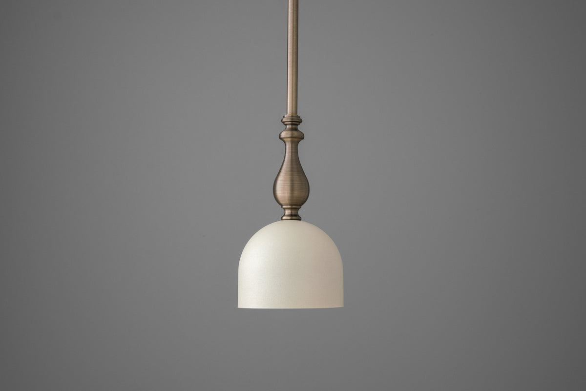 Antique brass deep ball pendant with cream dome shade hanging from matching rod. - PENDANT MODEL N0. 6780