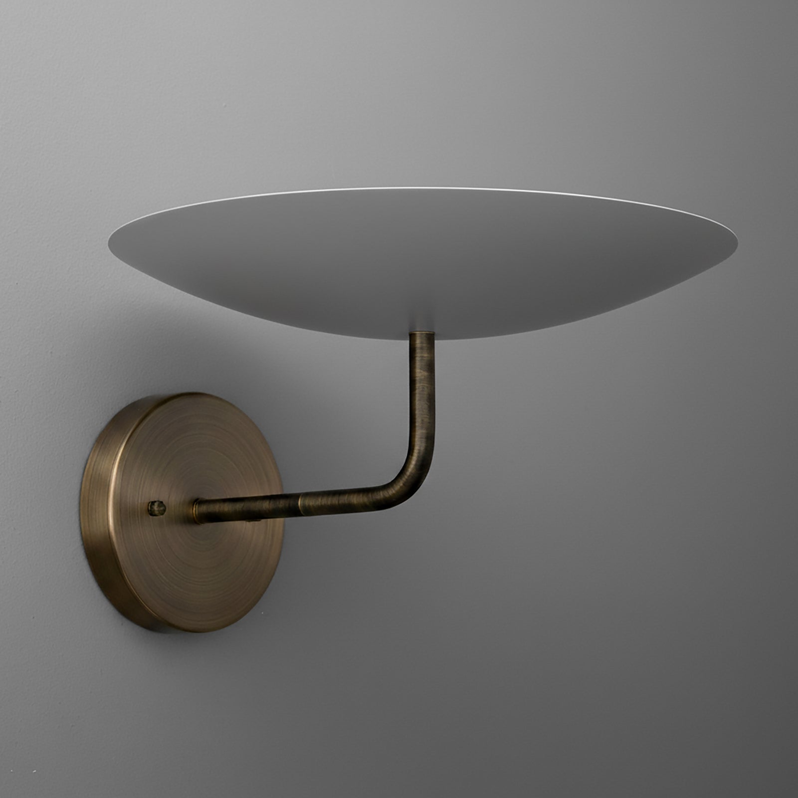 Antique brass 3-bulb sconce with curved arm and wide, shallow gray metal shade. - SCONCE MODEL NO. 1504