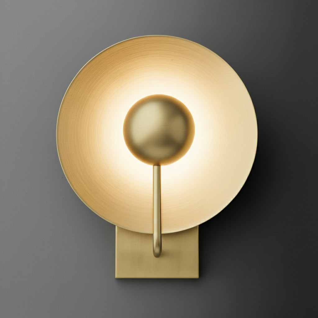 Brushed brass wall sconce with round backplate and frosted circular glass shade surrounding central bulb. - SCONCE MODEL NO. 7858