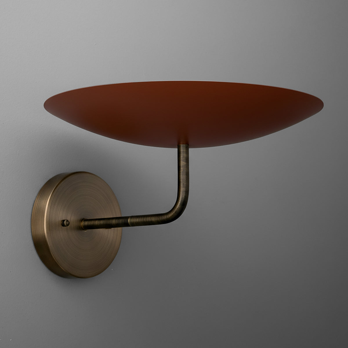Three-bulb wall sconce with round brass base and upward-facing wide shallow brown metal shade. - SCONCE MODEL NO. 1504