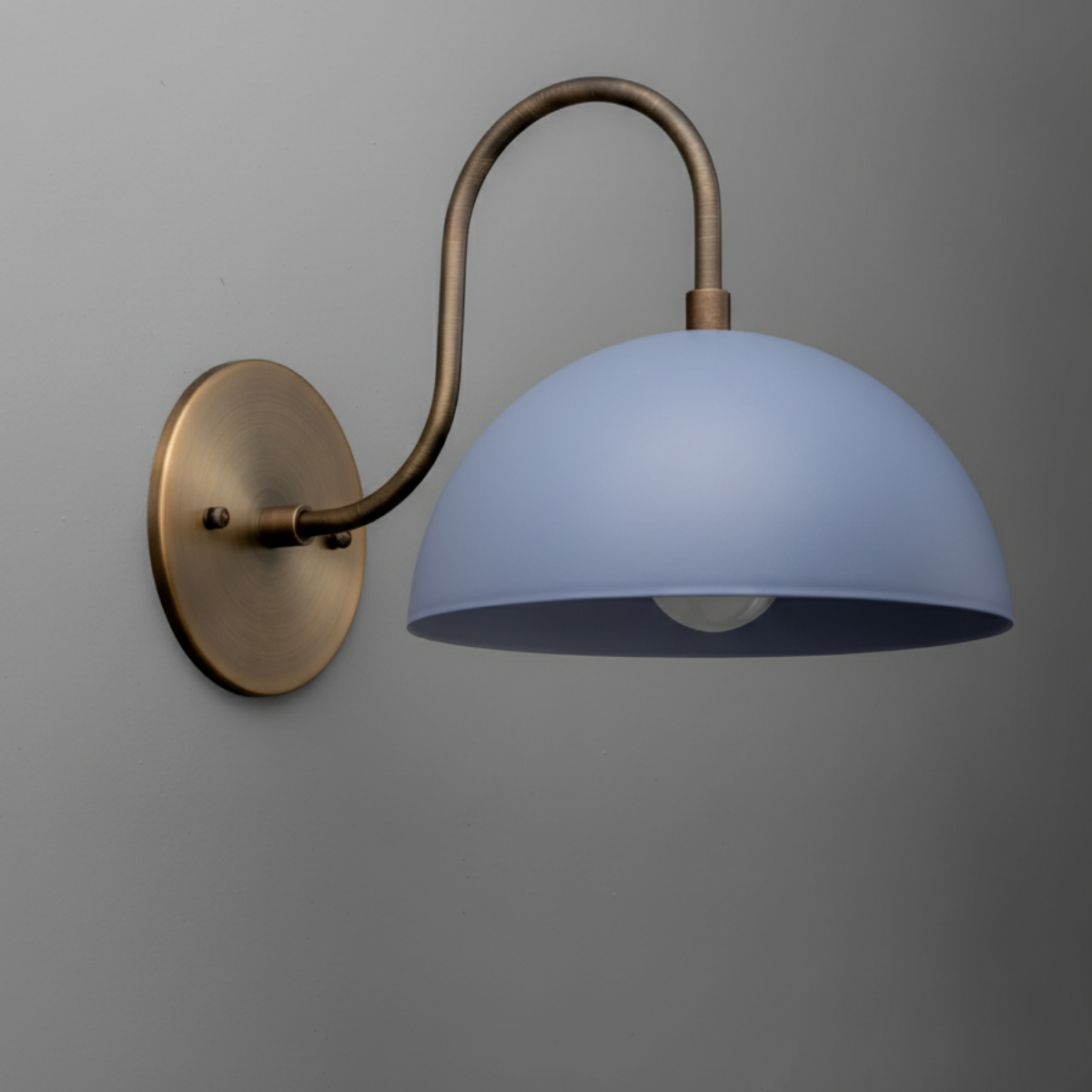 Antique brass wall sconce with curved arm and periwinkle dome shade. - SCONCE MODEL NO. 9092