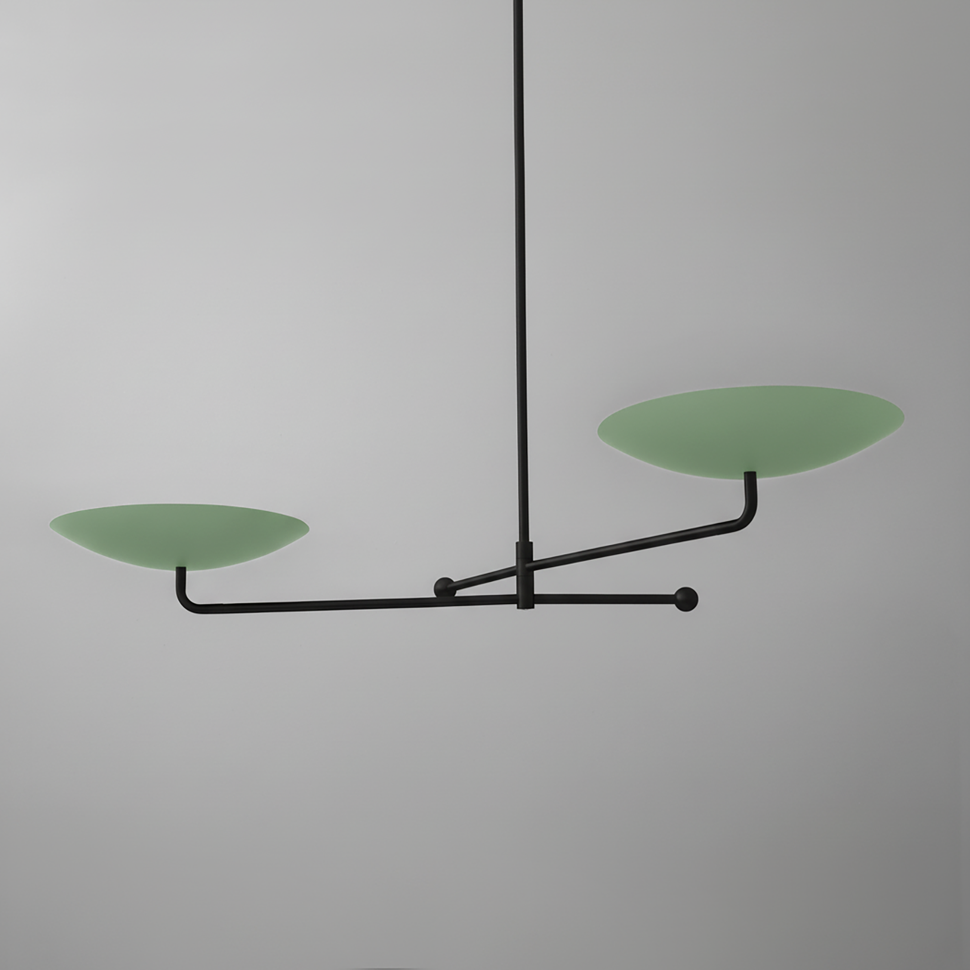 Modern black metal chandelier with two matte green disc-shaped shades on horizontal arms. - CHANDELIER MODEL NO. 0680