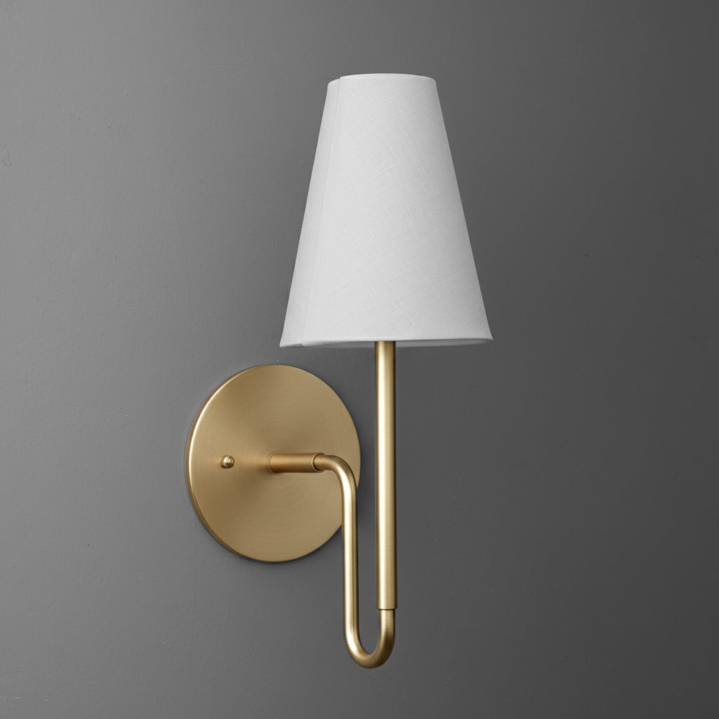 Matte gold metal wall sconce with round base and white tapered fabric shade. - SCONCE MODEL NO. 1007