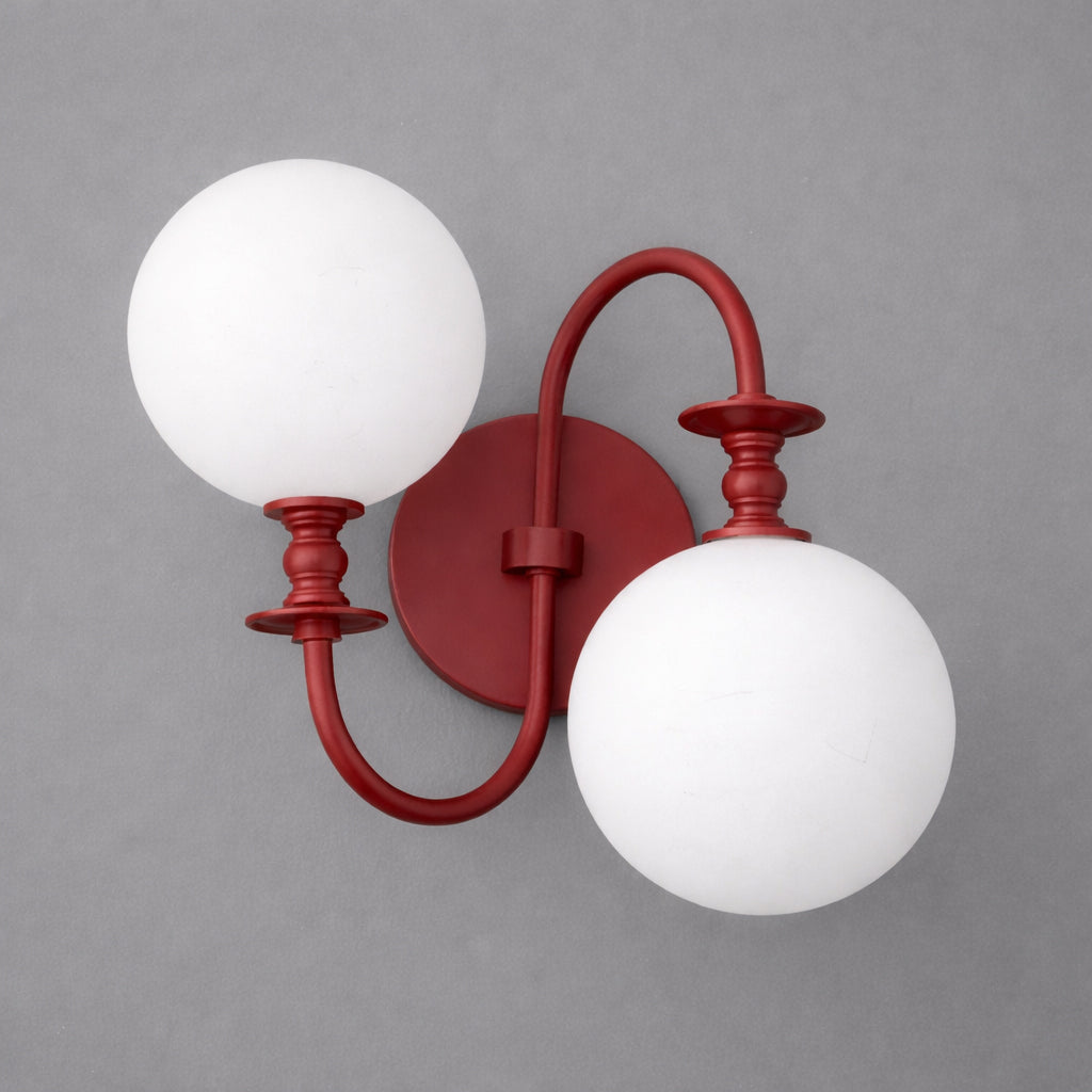 Red metal double-arm wall sconce with two white frosted glass globe shades. - SCONCE MODEL NO. 2429