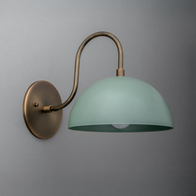 Antique brass wall sconce with curved arm and matte periwinkle dome shade. - SCONCE MODEL NO. 9092