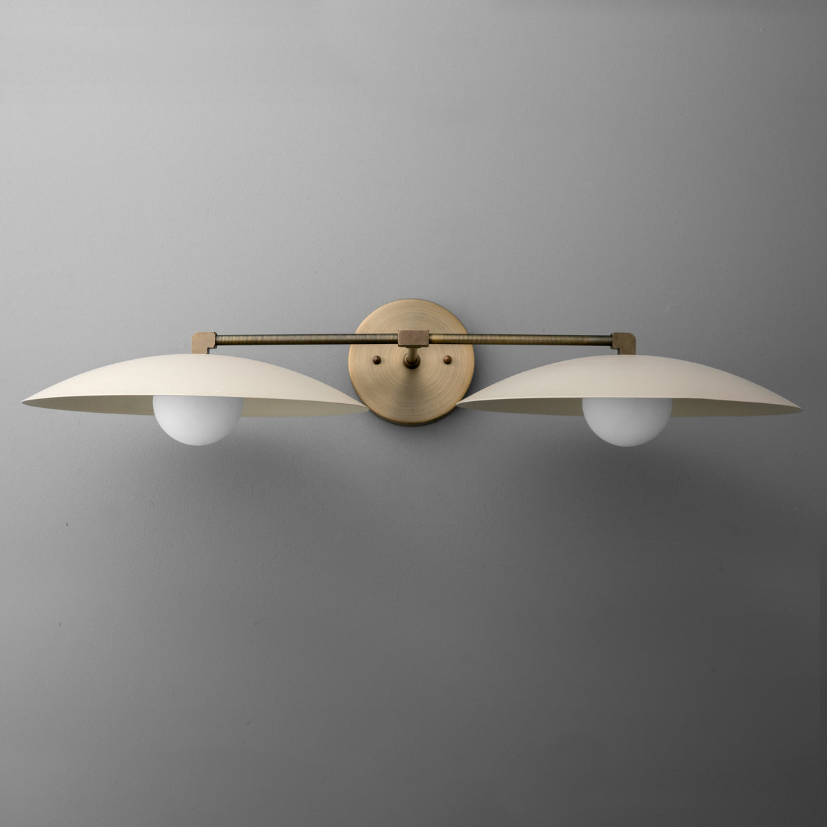Modern two-bulb vanity light with matte gold finish and white dome-shaped glass shades. - VANITY LIGHT MODEL NO. 1168