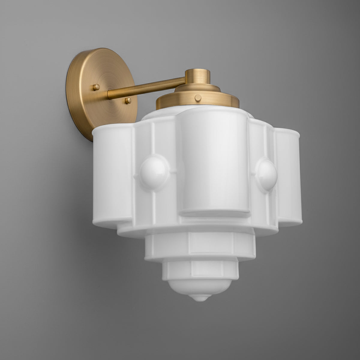 Matte gold metal wall sconce with a white geometric glass shade and single bulb design. - SCONCE MODEL NO. 1064