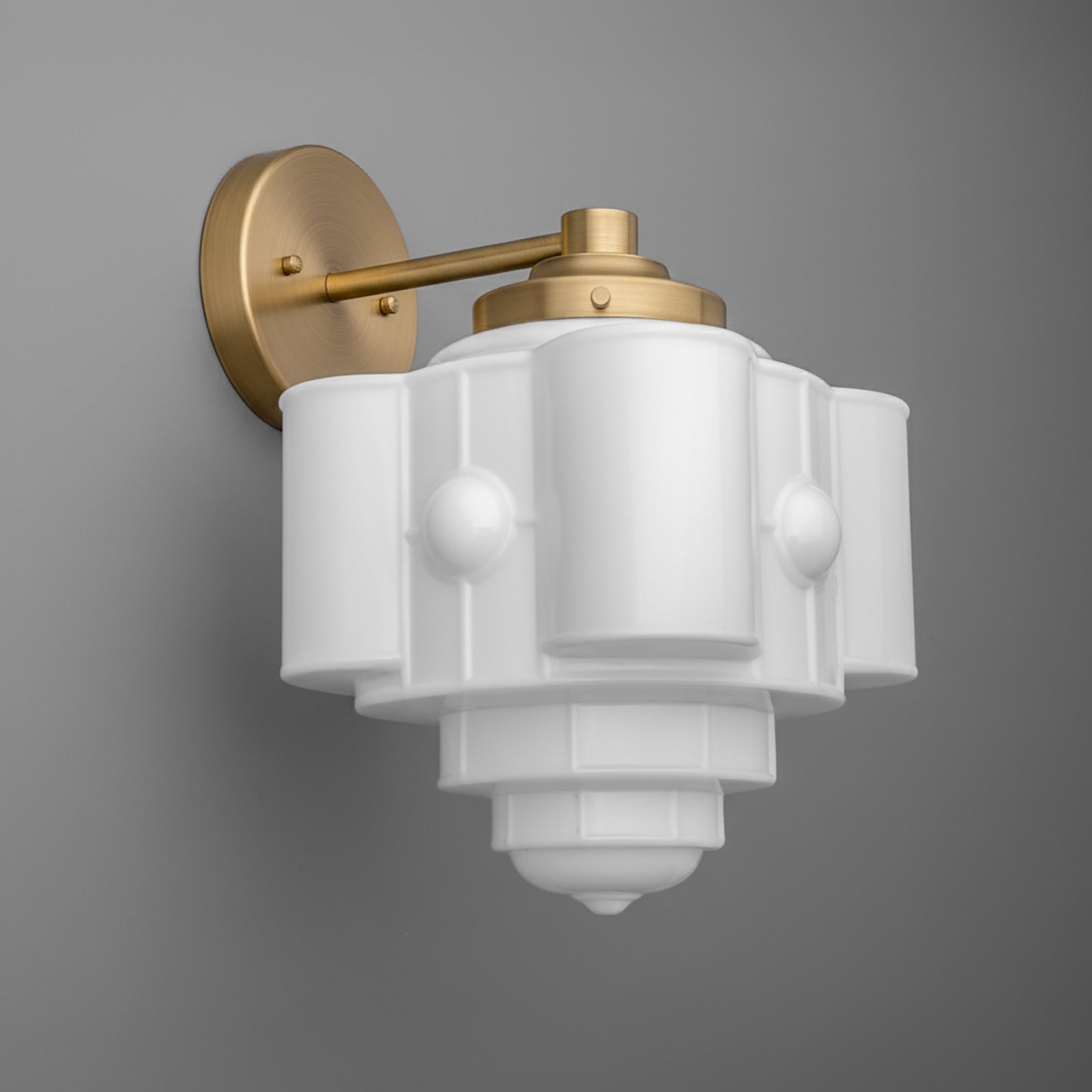 Matte gold metal wall sconce with a white geometric glass shade and single bulb design. - SCONCE MODEL NO. 1064