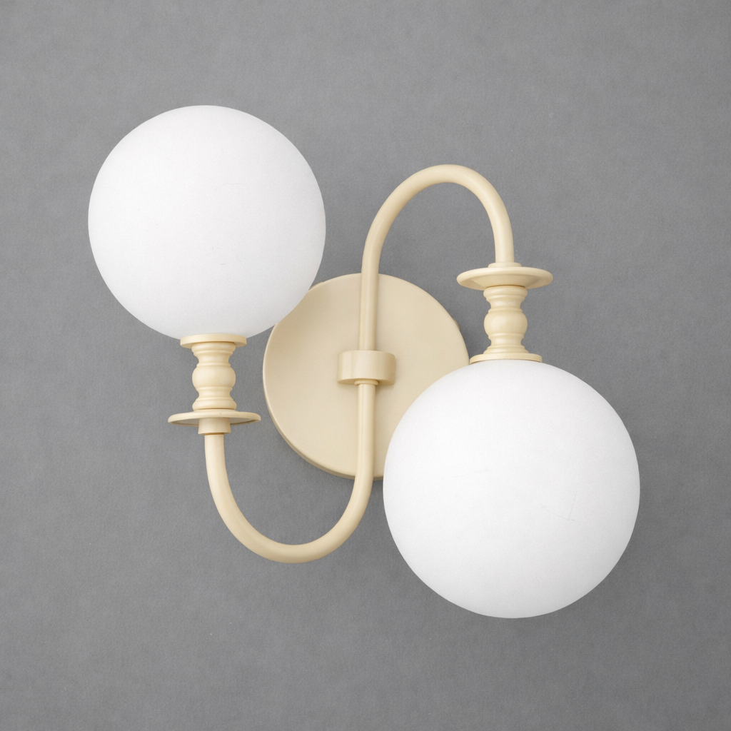 Matte cream metal wall sconce with two curved arms holding large white frosted glass globe shades. - SCONCE MODEL NO. 2429