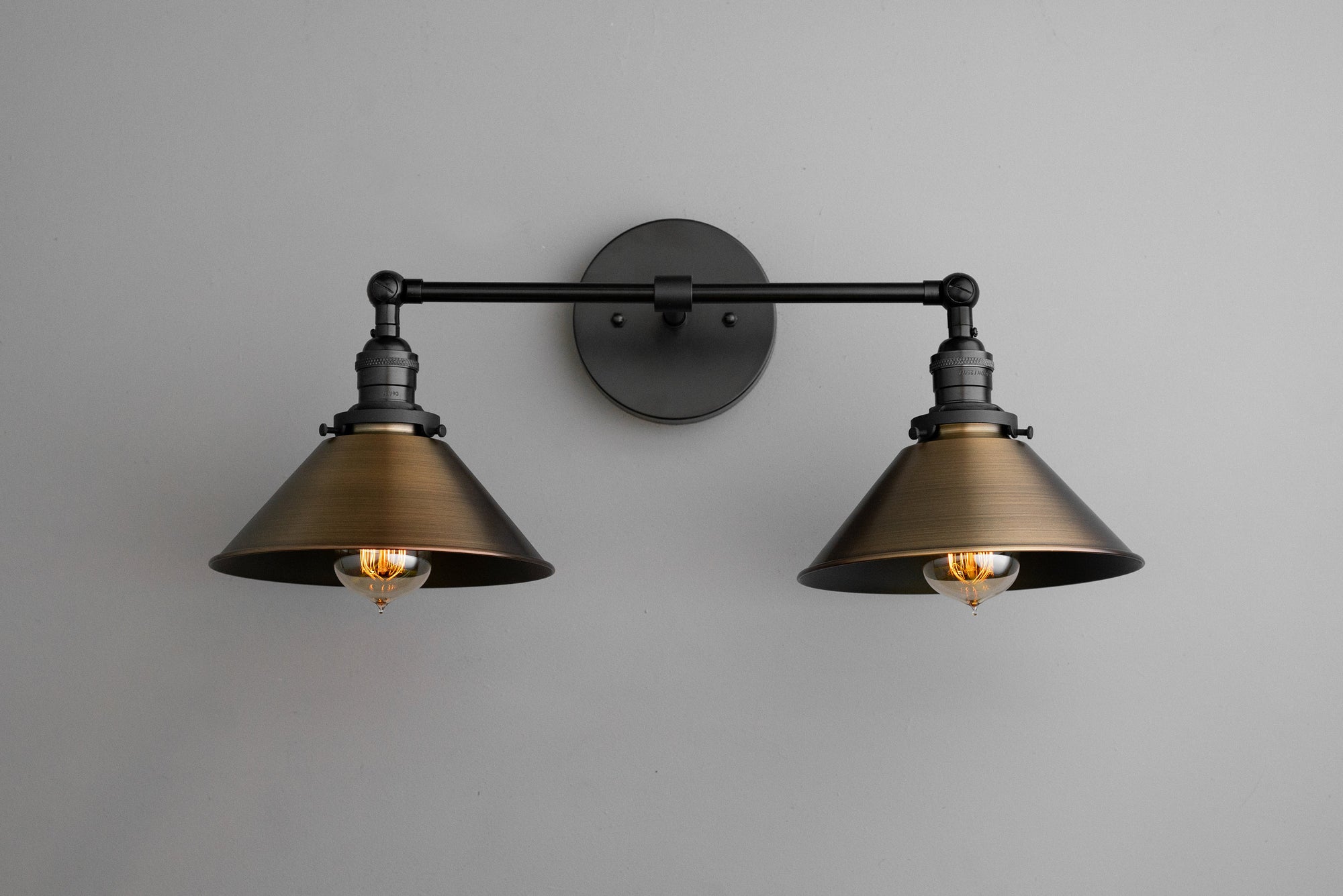 Industrial 2-bulb vanity light with black metal shades and exposed Edison bulbs. - VANITY LIGHT MODEL NO. 1861