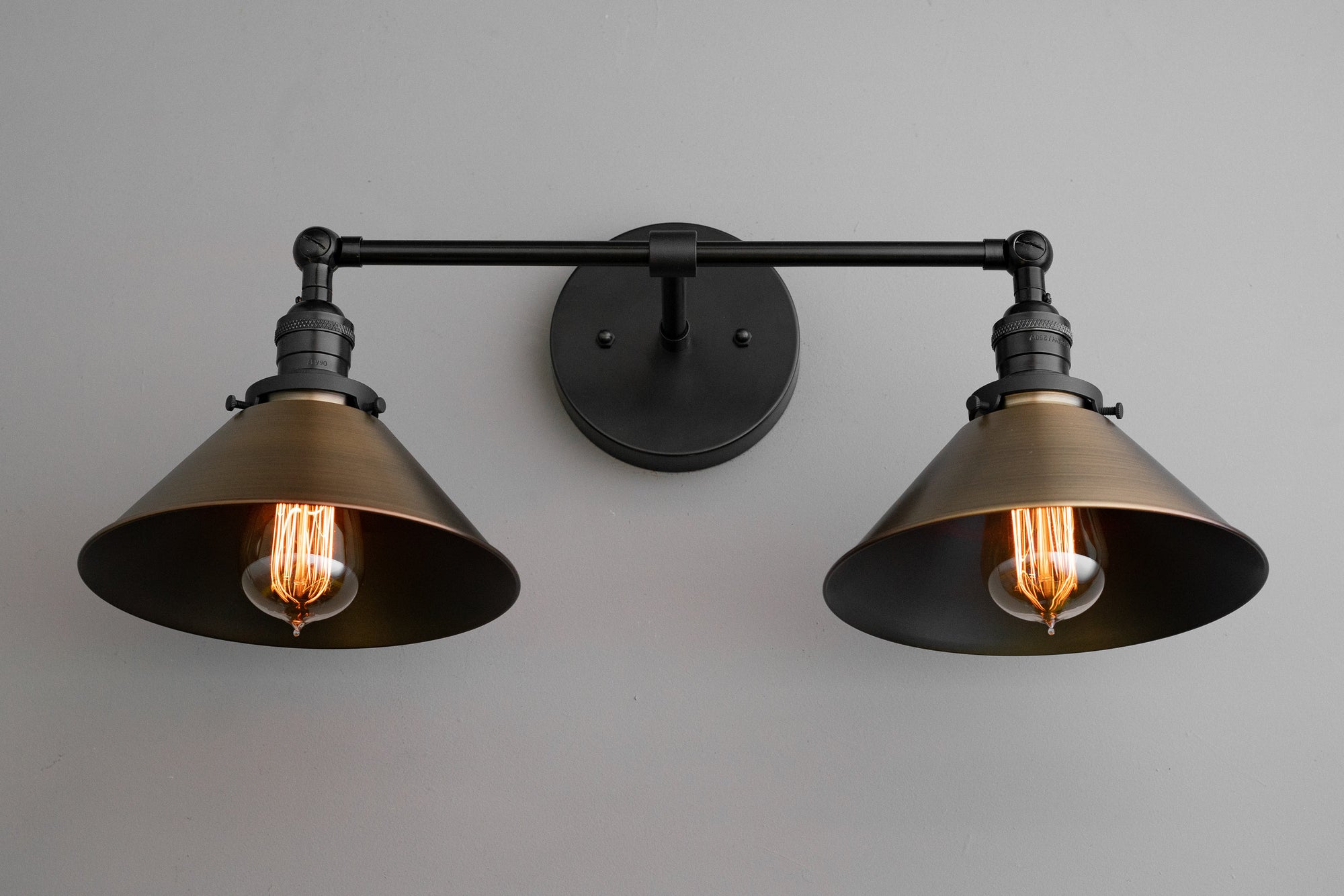 Industrial-style vanity light with two black metal shades and exposed vintage filament bulbs. - VANITY LIGHT MODEL NO. 1861