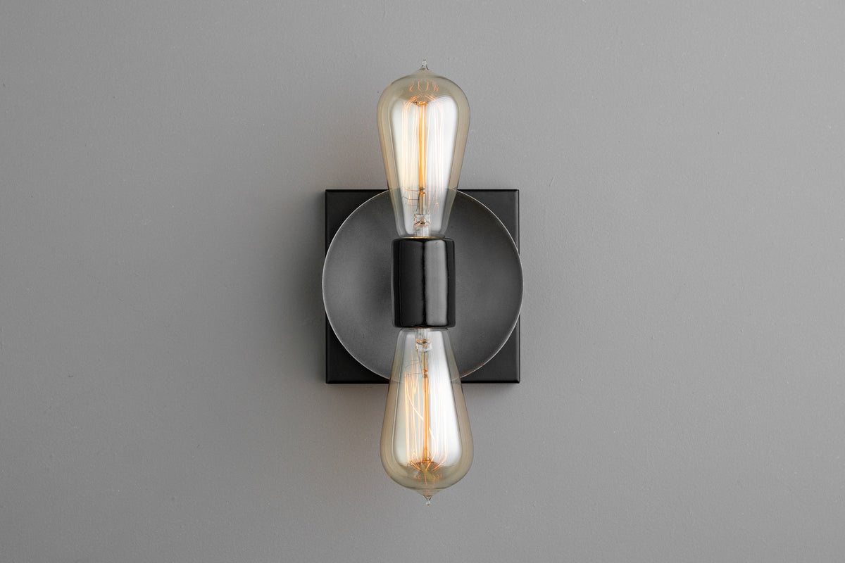Industrial-style black metal sconce with exposed vintage-style filament bulbs in vertical arrangement. - SCONCE MODEL NO. 8169