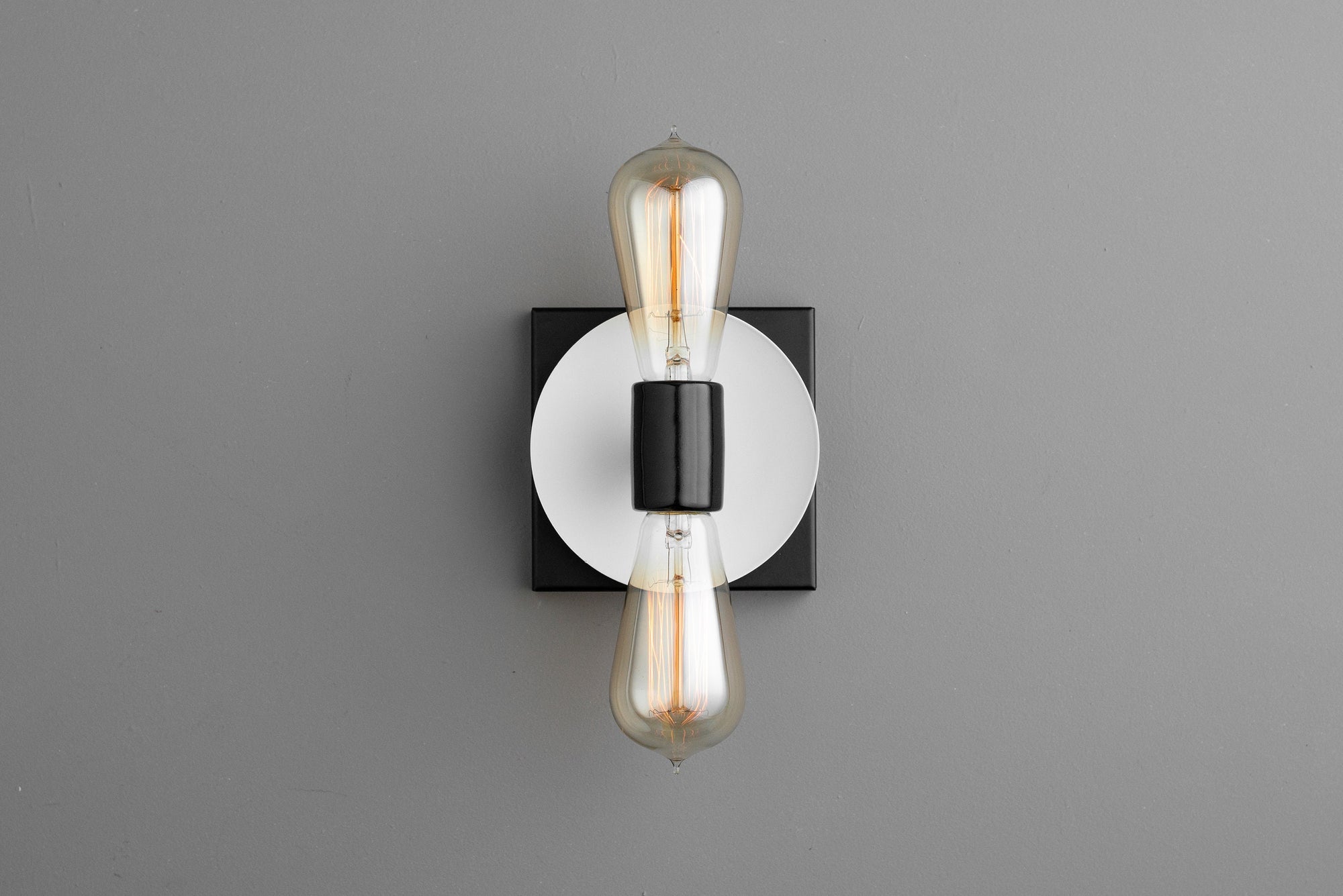 Industrial-style sconce with exposed filament bulbs, black and white metal design, semi-flush mount. - SCONCE MODEL NO. 8169