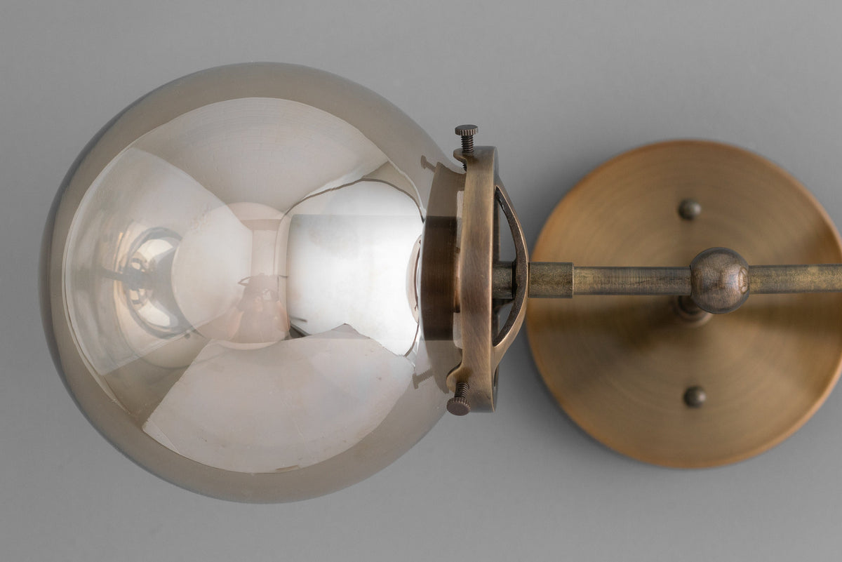 Mid-century modern antique brass vanity light with two globe bulbs and industrial design. - VANITY LIGHT MODEL NO. 8983