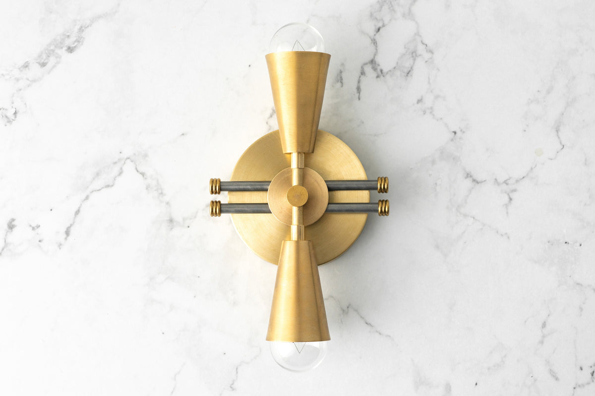 Art Deco style wall sconce in raw brass with dual exposed bulbs and horizontal black steel rods. - SCONCE MODEL NO. 3419