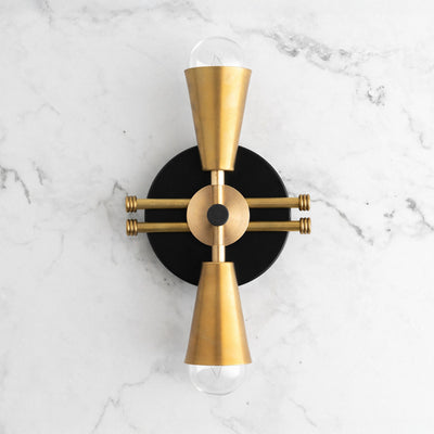 Art Deco black and raw brass wall sconce with up/down bare bulbs on marble wall. - SCONCE MODEL NO. 3419