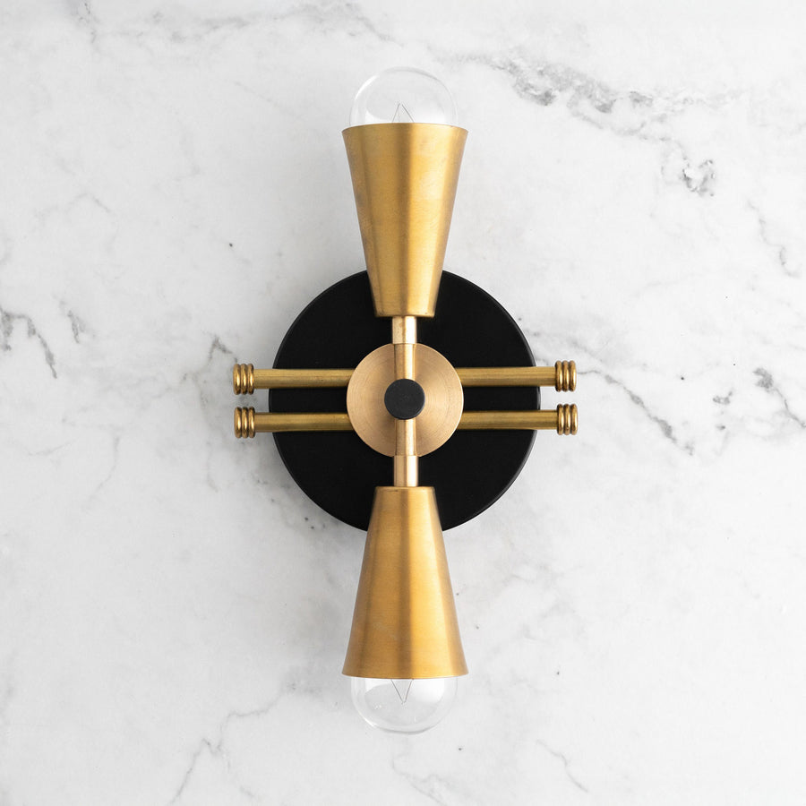 Art Deco black and raw brass wall sconce with up/down bare bulbs on marble wall. - SCONCE MODEL NO. 3419