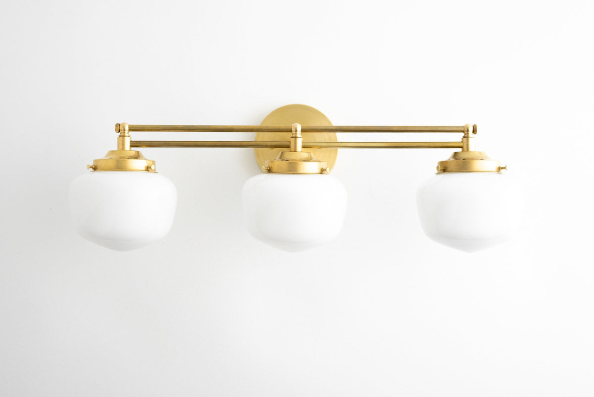 Art deco 3-bulb vanity light with round white glass globes and brass finish. - VANITY LIGHT MODEL NO. 4352
