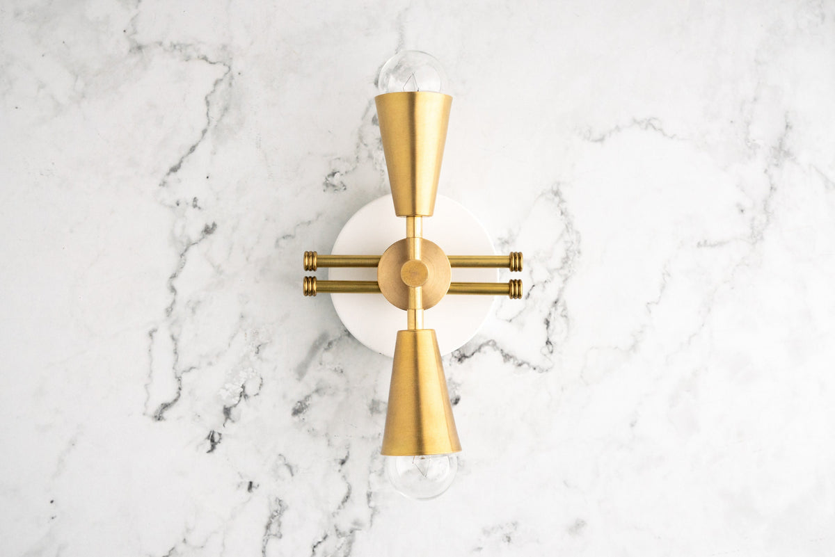 Art Deco style sconce with raw brass finish, featuring upward and downward exposed bulbs and geometric design. - SCONCE MODEL NO. 3419