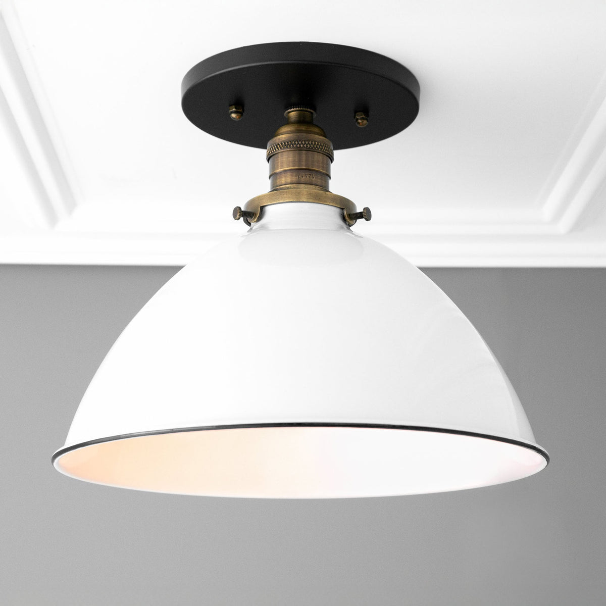 Flush ceiling light with a Black canopy, an Antique Brass socket and a wide metal dome shade. - CEILING LIGHT MODEL NO. 8809