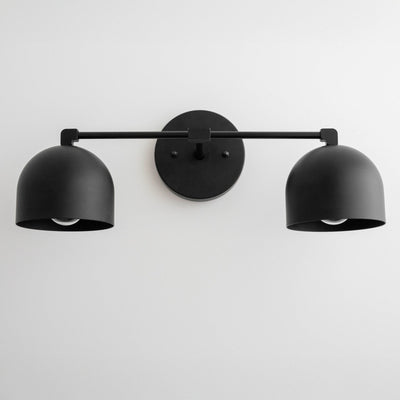 Black metal vanity light with two dome-shaped shades and round wall mount, mid-century modern style. - VANITY LIGHT MODEL NO. 0698