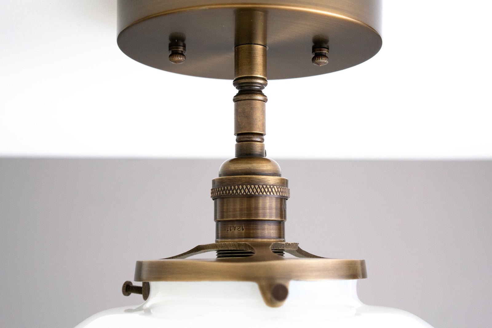 Semi-flush antique brass ceiling light with round white globe shade and detailed metal fixture. - CEILING LIGHT MODEL NO. 9512