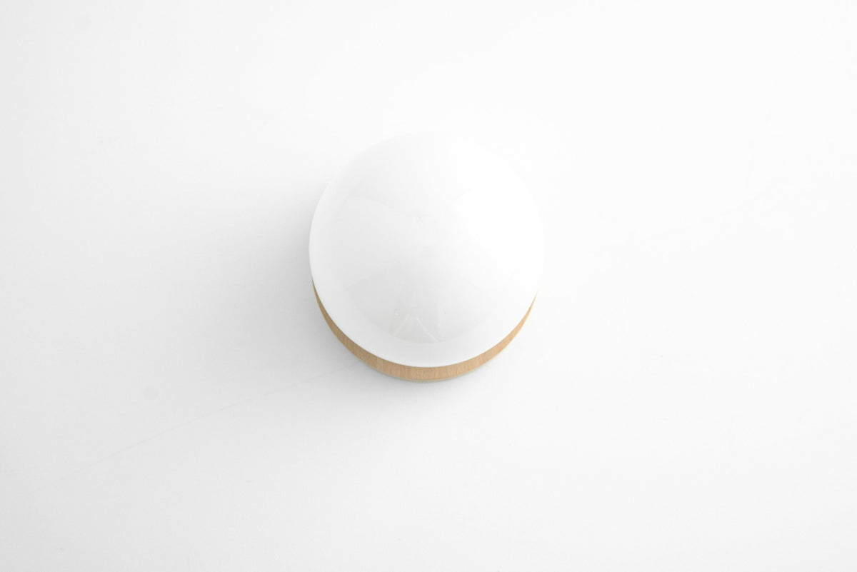 Round white glass globe sconce with natural wood base in Scandinavian style against white background. - SCONCE MODEL NO. 5719