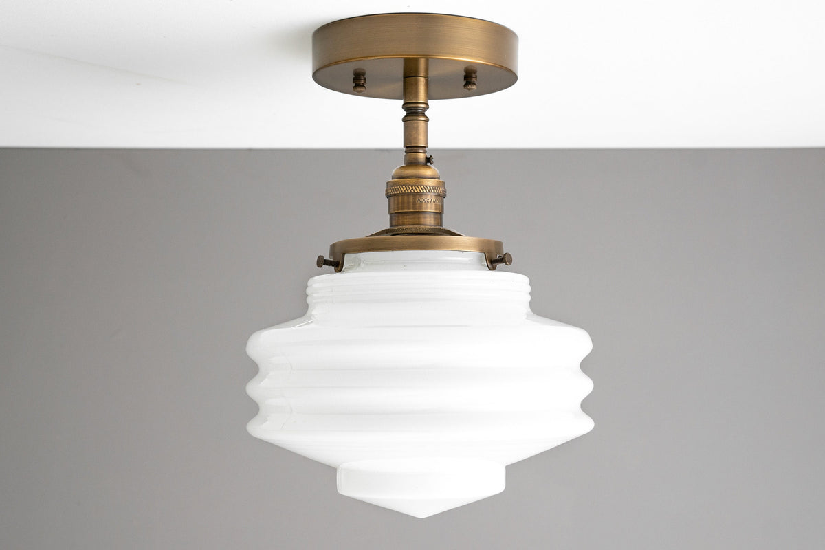 Art Deco semi-flush ceiling light with ribbed white glass globe and antique brass finish. - CEILING LIGHT MODEL NO. 8744
