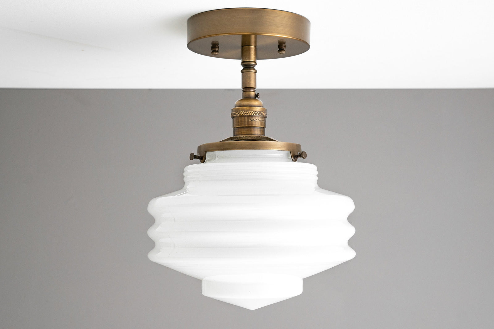 Art Deco semi-flush ceiling light with ribbed white glass globe and antique brass finish. - CEILING LIGHT MODEL NO. 8744