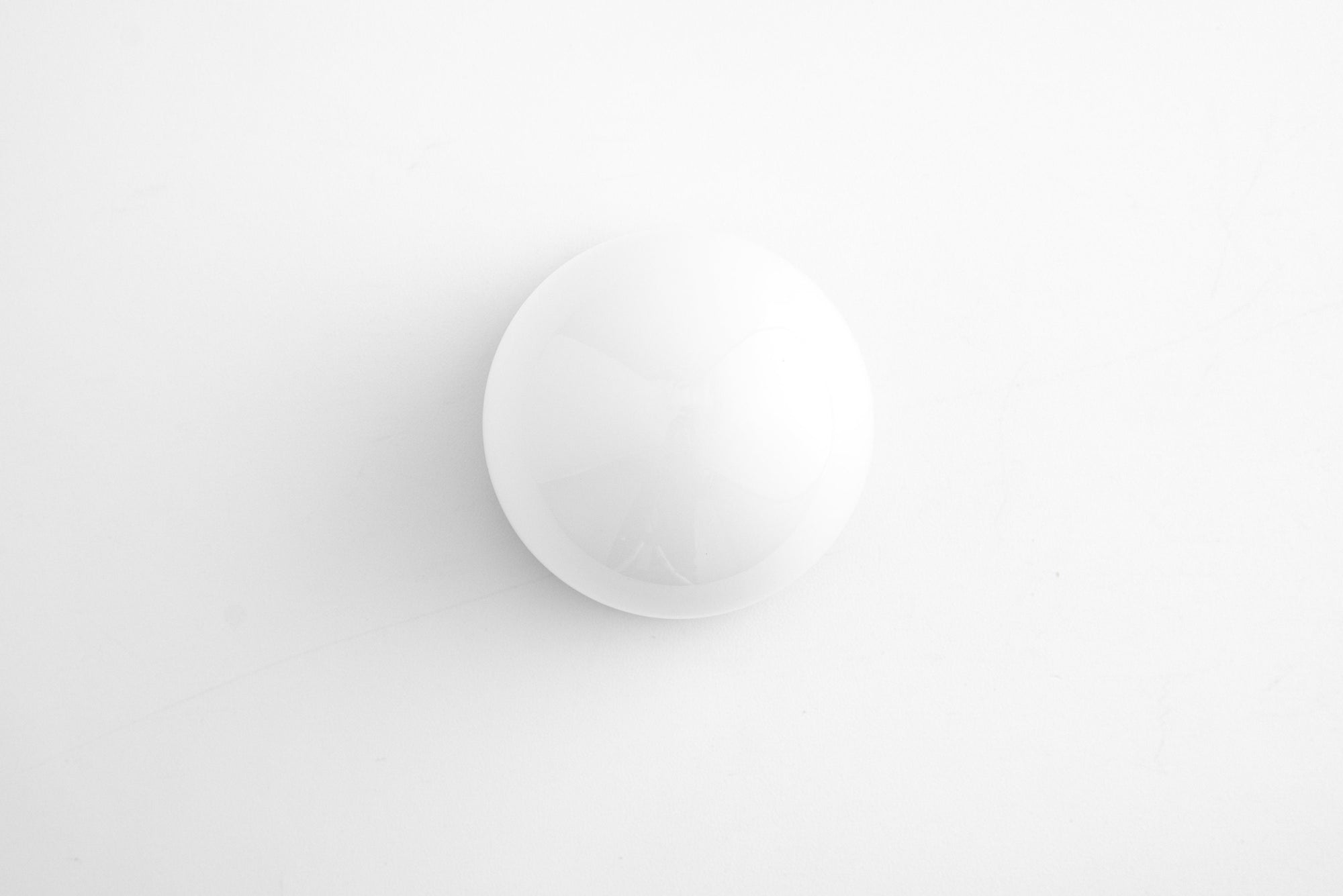 Minimalist round white glass globe wall sconce with matte finish and flush mount. - SCONCE MODEL NO. 5719