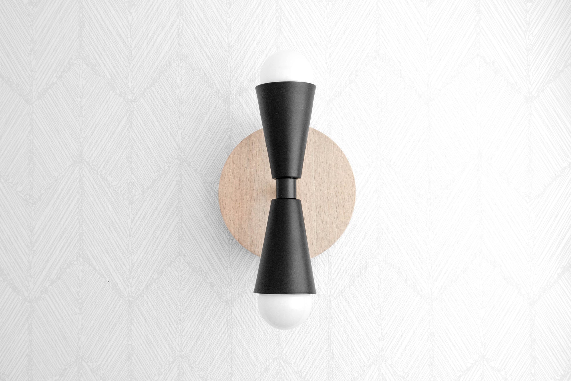 Scandinavian-style wall sconce with black metal hourglass shade and natural beechwood round base. - SCONCE MODEL NO. 4717