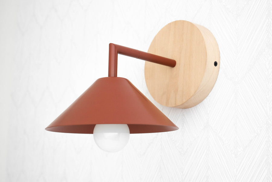Semi-flush brick red metal sconce with conical shade and natural beechwood round wall mount. - SCONCE MODEL NO. 1721