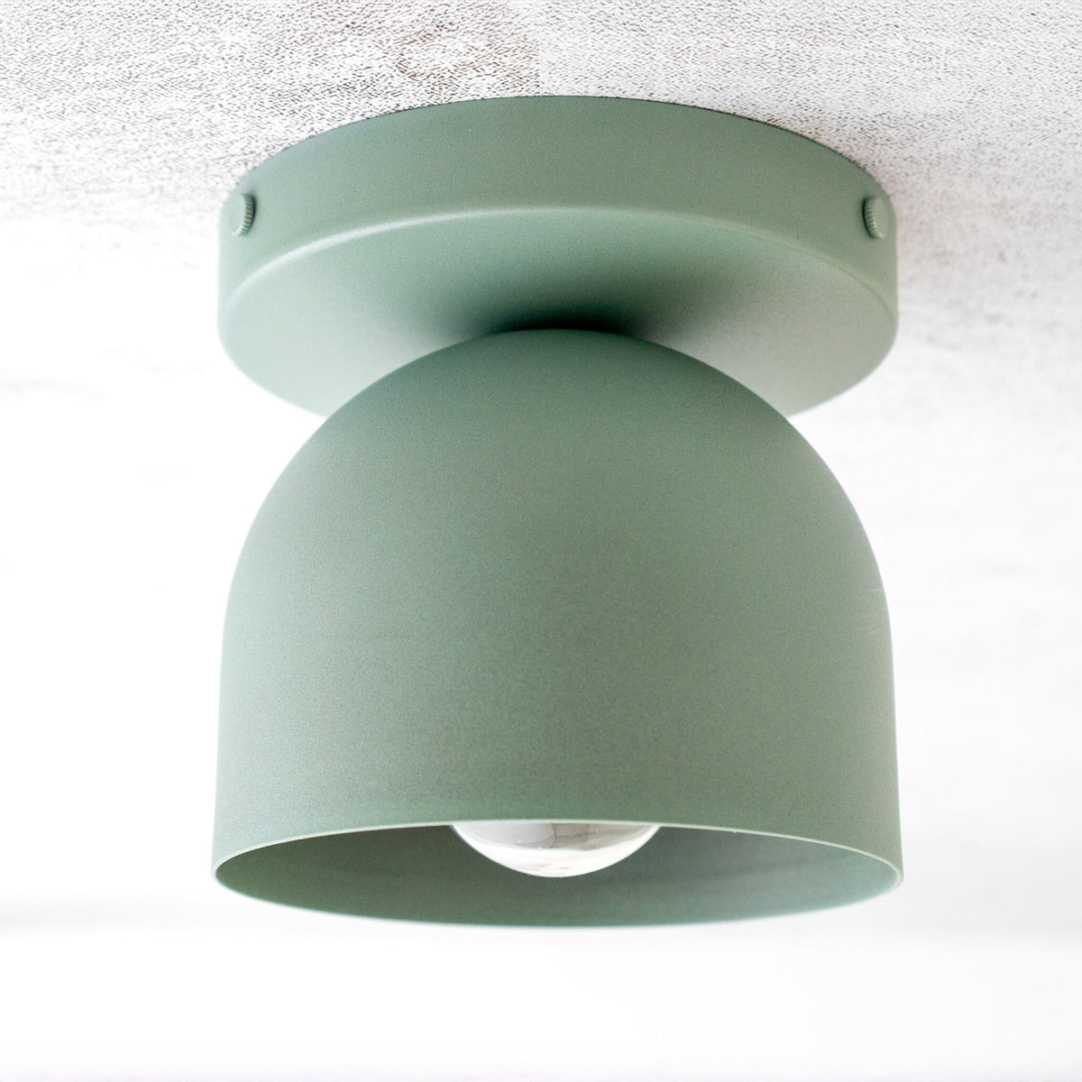 Matte sage green Scandinavian flush mount ceiling light with dome-shaped shade and exposed bulb. - CEILING LIGHT MODEL NO. 1107