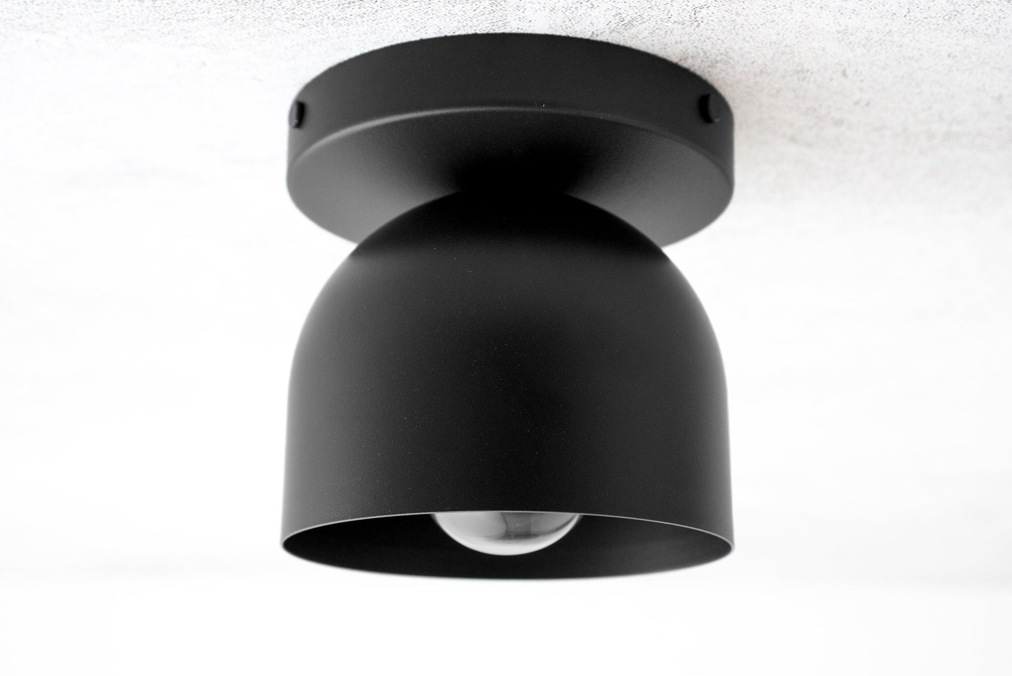 Matte black flush mount ceiling light with rounded deep shade and exposed bulb. - CEILING LIGHT MODEL NO. 1107
