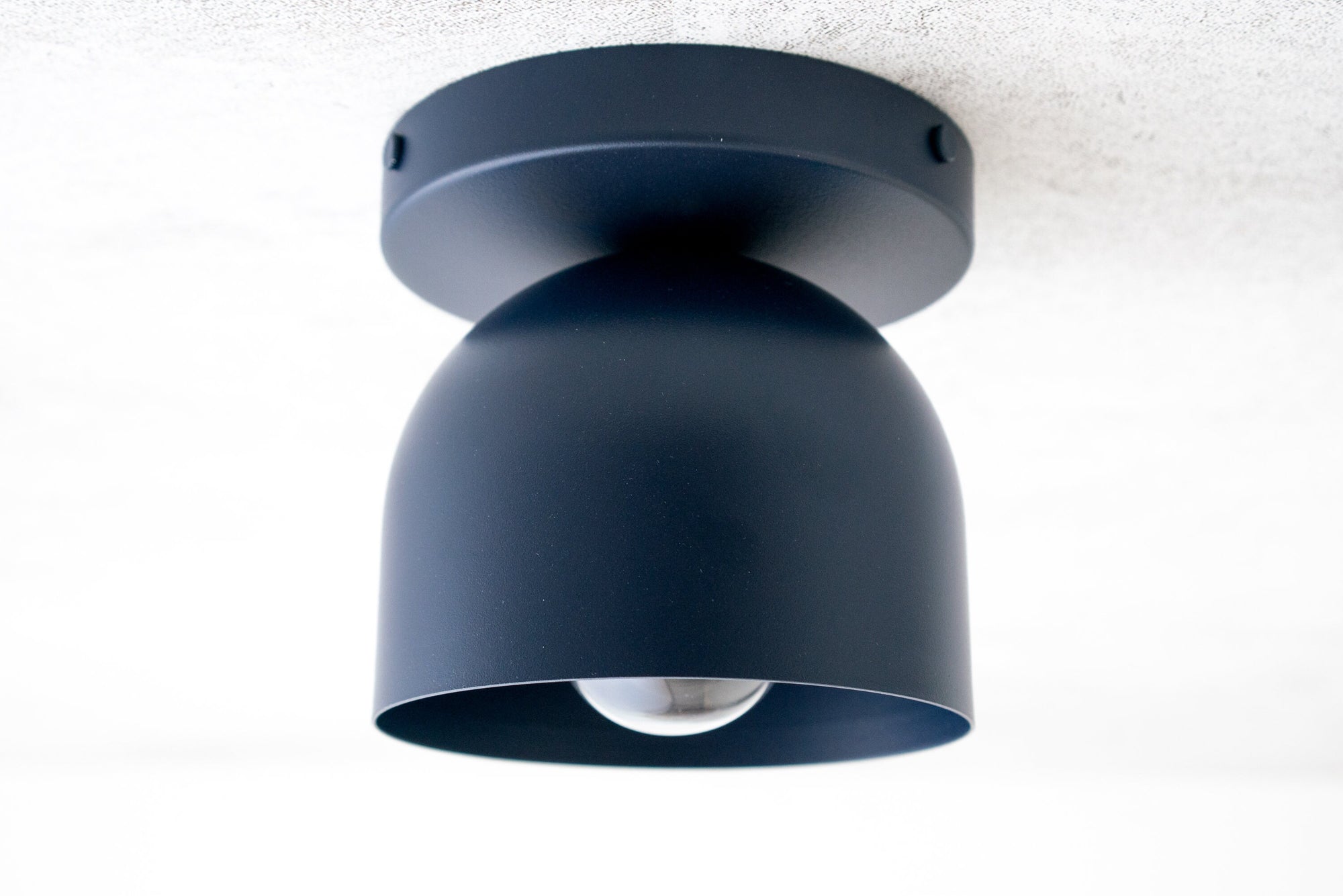 Matte black flush mount ceiling light with a rounded deep shade and exposed bulb design. - CEILING LIGHT MODEL NO. 1107