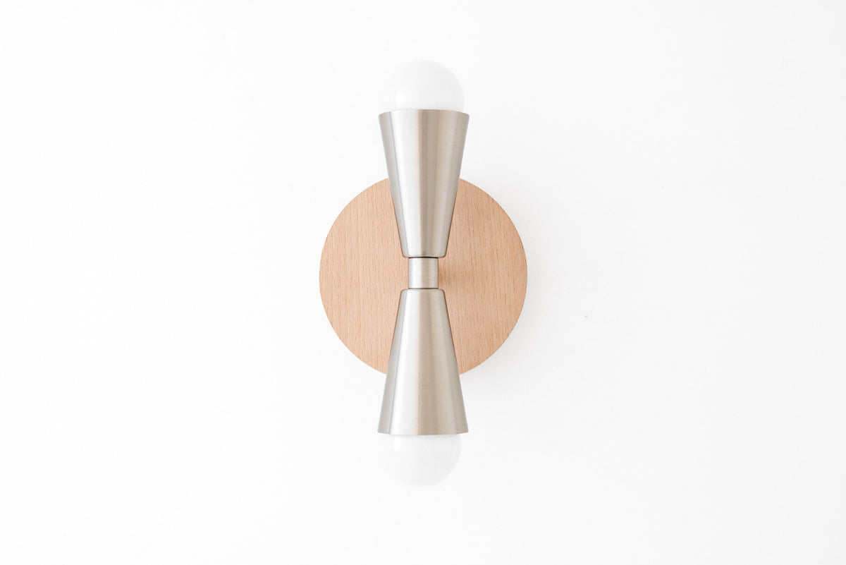 Scandinavian style sconce with beechwood backplate and brushed nickel double cone fixture with exposed bulbs. - SCONCE MODEL NO. 4717