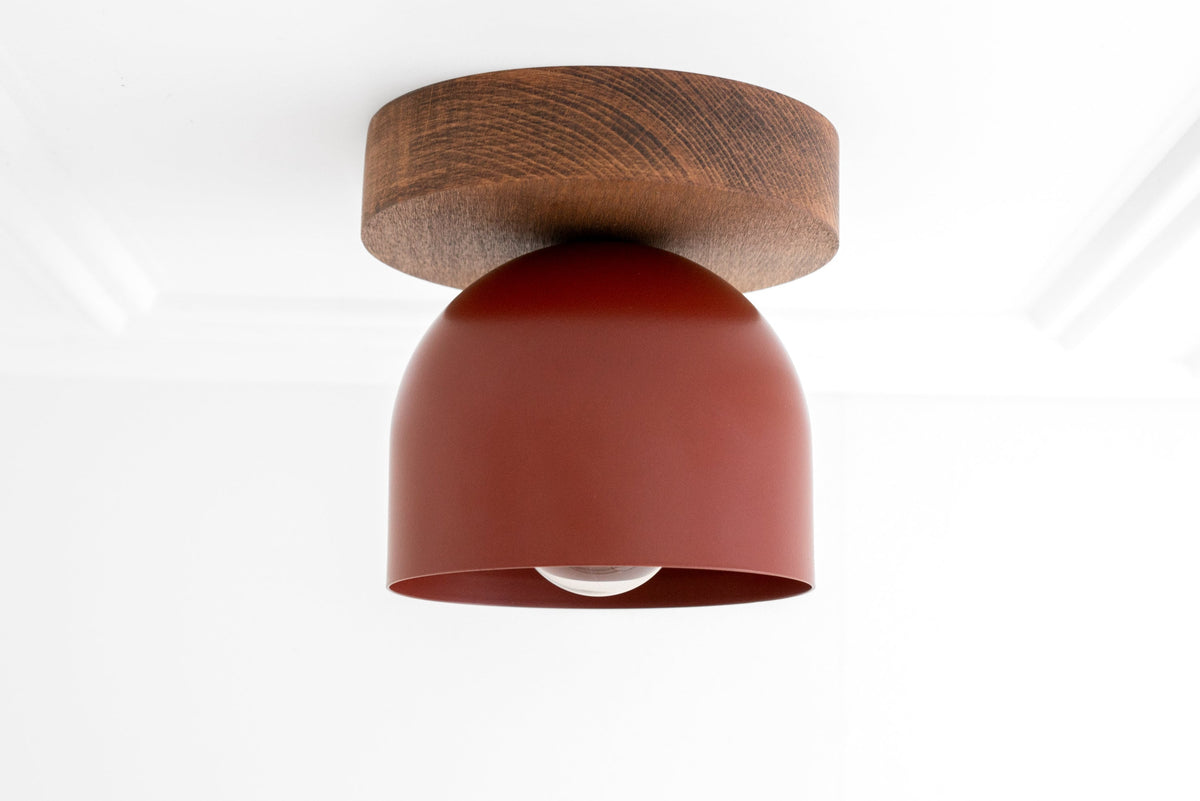 Flush mount ceiling light with oak wood base and smooth brick red dome shade. - CEILING LIGHT MODEL NO. 1107