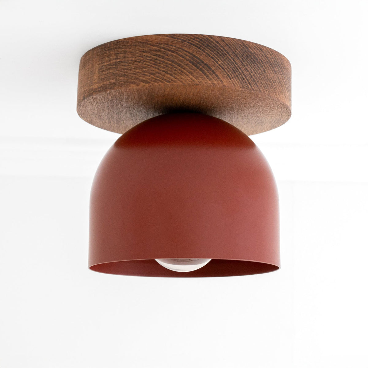 Flush mount ceiling light with oak finish base and brick red matte dome shade. - CEILING LIGHT MODEL NO. 1107