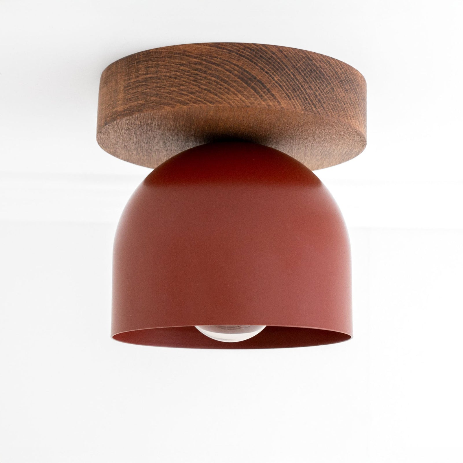 Flush mount ceiling light with oak finish base and brick red matte dome shade. - CEILING LIGHT MODEL NO. 1107